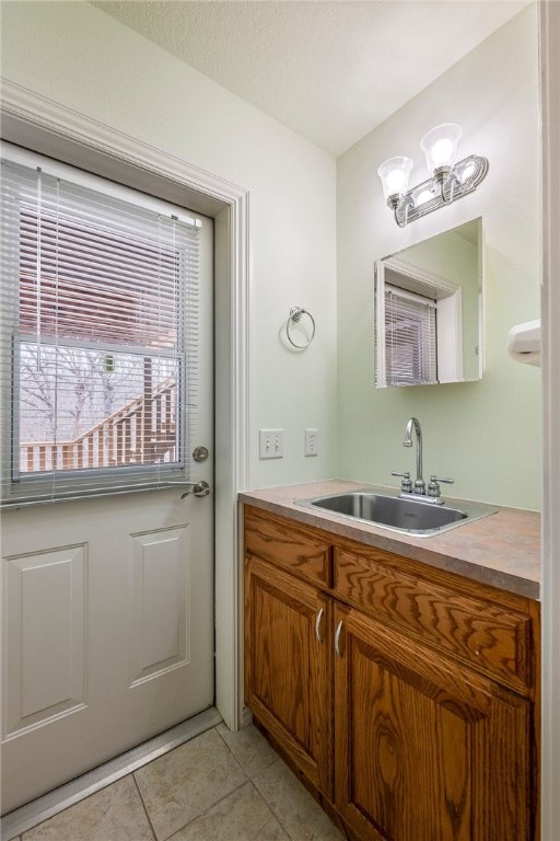 bathroom with vanity and tile patterned flooring