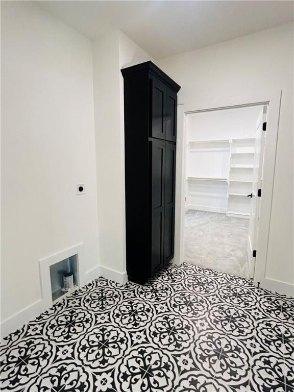 laundry room featuring cabinets and hookup for an electric dryer