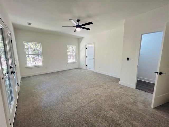 unfurnished room featuring carpet and ceiling fan