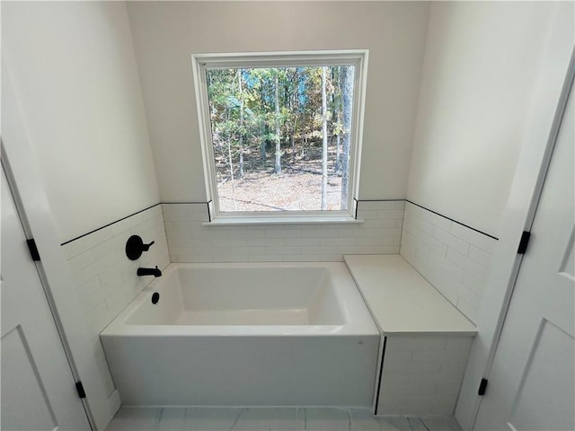 bathroom featuring a tub to relax in