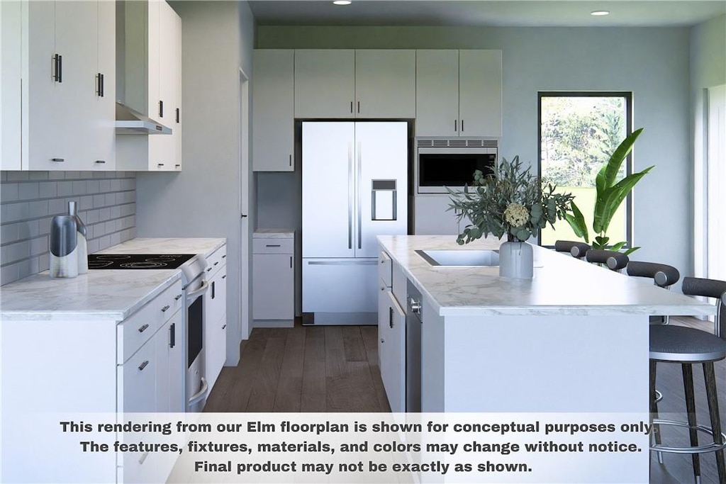 kitchen with dark hardwood / wood-style floors, tasteful backsplash, white cabinets, a kitchen breakfast bar, and white appliances