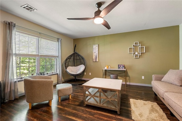 living room with ceiling fan and dark hardwood / wood-style floors