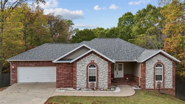 view of front facade featuring a garage and a front yard