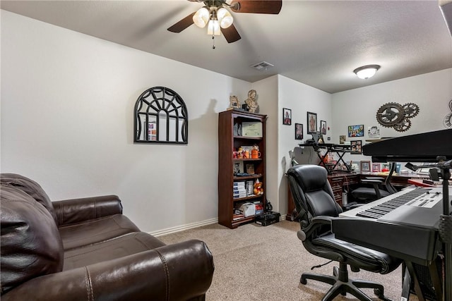 office area with light colored carpet and ceiling fan