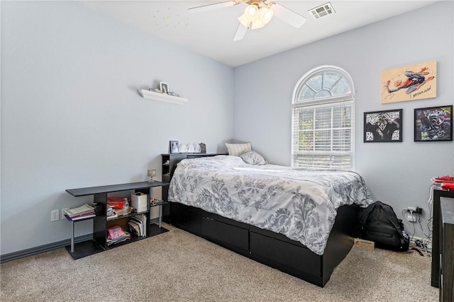 carpeted bedroom with ceiling fan