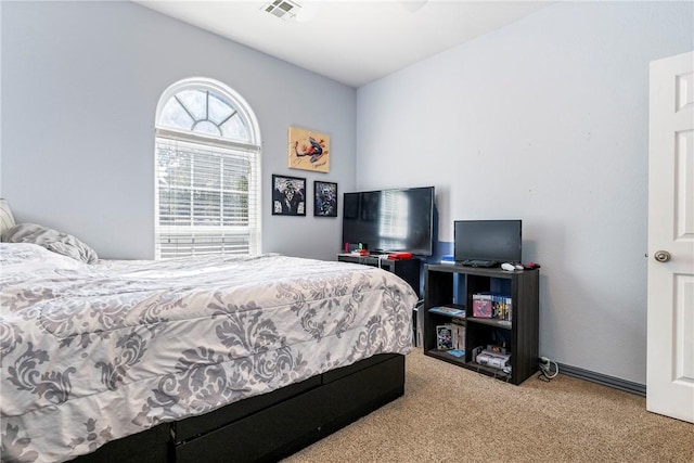 bedroom featuring light carpet