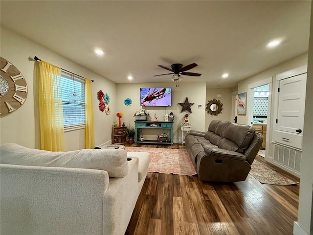 living room with hardwood / wood-style floors and ceiling fan