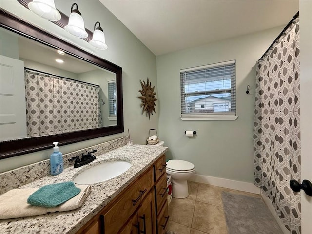 bathroom with vanity, curtained shower, tile patterned floors, and toilet