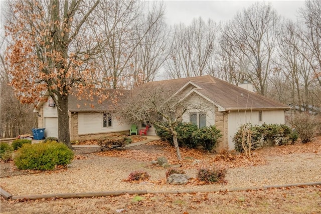2 Quantock Hills Ln, Bella Vista, AR 72715 - ranch-style home with brick siding and a chimney