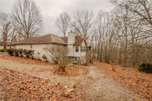 2 Quantock Hills Ln, Bella Vista, AR 72715 - view of side of property with a chimney