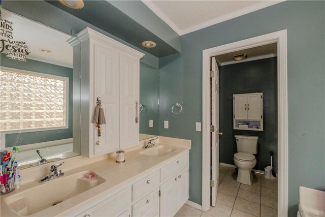 bathroom featuring toilet, ornamental molding, vanity, a bath, and tile patterned flooring