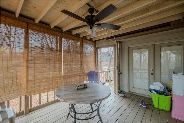 sunroom / solarium featuring ceiling fan, wood ceiling, and beam ceiling