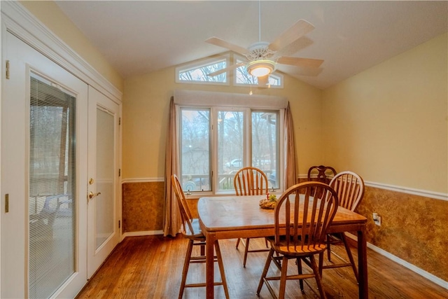 2 Quantock Hills Ln, Bella Vista, AR 72715 - dining room featuring wood finished floors, baseboards, a ceiling fan, vaulted ceiling, and a wainscoted wall