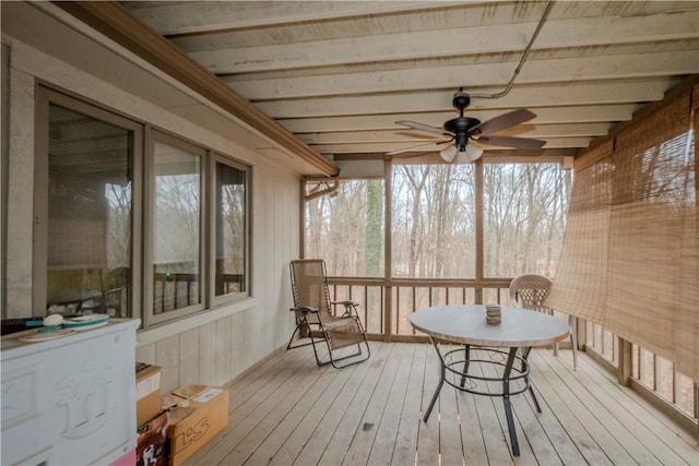 sunroom / solarium featuring ceiling fan