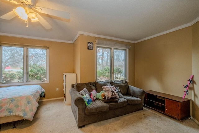 bedroom featuring ornamental molding, light carpet, and ceiling fan