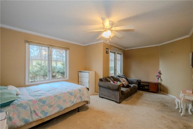 bedroom with crown molding, carpet flooring, and ceiling fan