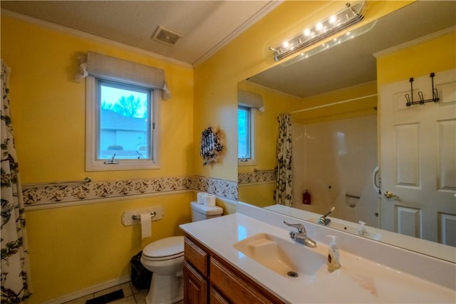 bathroom featuring tile patterned flooring, ornamental molding, vanity, walk in shower, and toilet