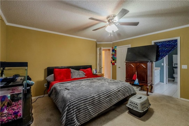 carpeted bedroom featuring crown molding, connected bathroom, ceiling fan, and a textured ceiling