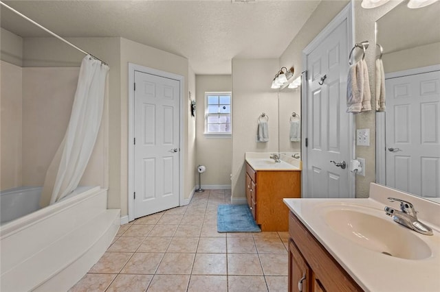 819 Hindman Dr, Prairie Grove, AR 72753 - bathroom featuring a shower with curtain, vanity, tile patterned flooring, and a textured ceiling