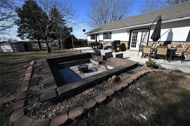 view of patio / terrace featuring an outdoor fire pit