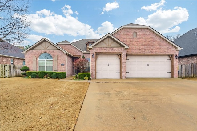 view of front of property featuring a garage and a front yard