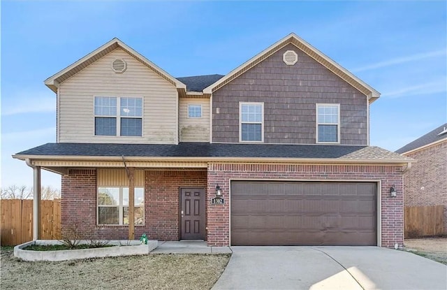 view of front of property with a garage and covered porch