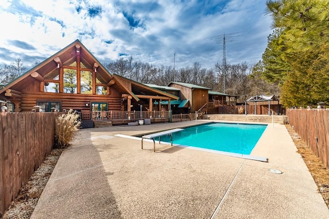 view of swimming pool with a fenced in pool, a patio area, a deck, a fenced backyard, and a diving board