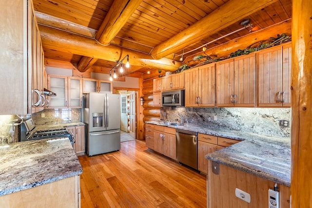 kitchen featuring log walls, tasteful backsplash, appliances with stainless steel finishes, light wood-style floors, and wooden ceiling