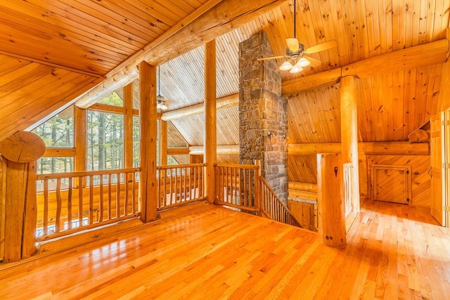 bonus room with lofted ceiling with beams, hardwood / wood-style flooring, ceiling fan, and wooden ceiling