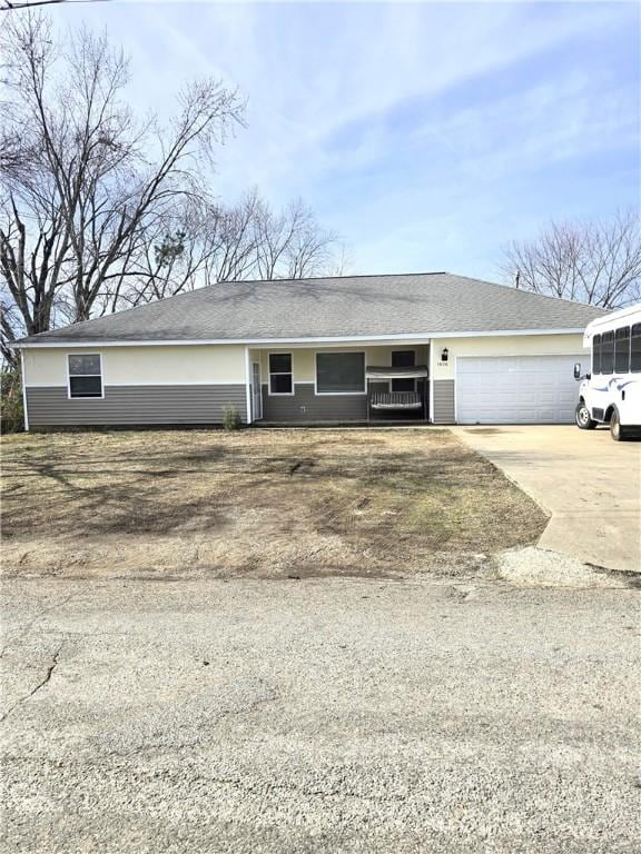 ranch-style home featuring a garage