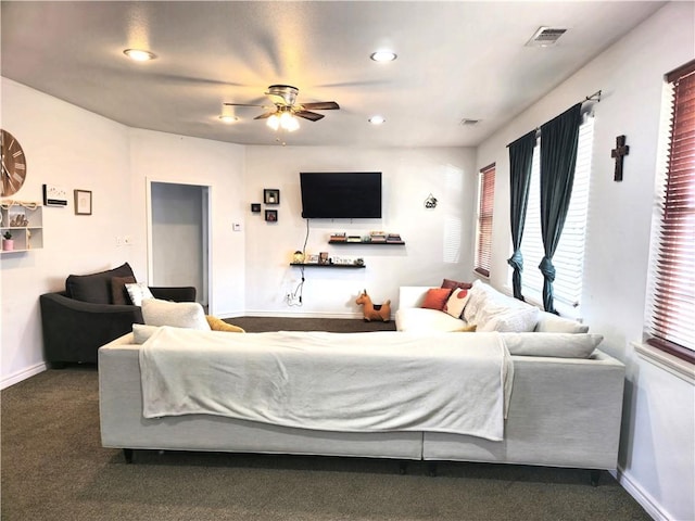 bedroom featuring dark carpet and ceiling fan