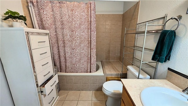 full bathroom with vanity, shower / tub combo, toilet, and tile patterned floors