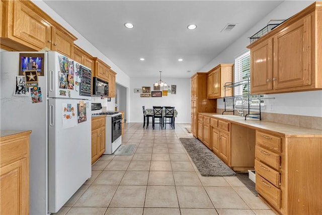 1408 N B St, Rogers, AR 72756 - kitchen with white appliances, light tile patterned floors, light countertops, recessed lighting, and a chandelier