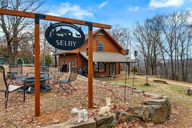 exterior space with a fire pit