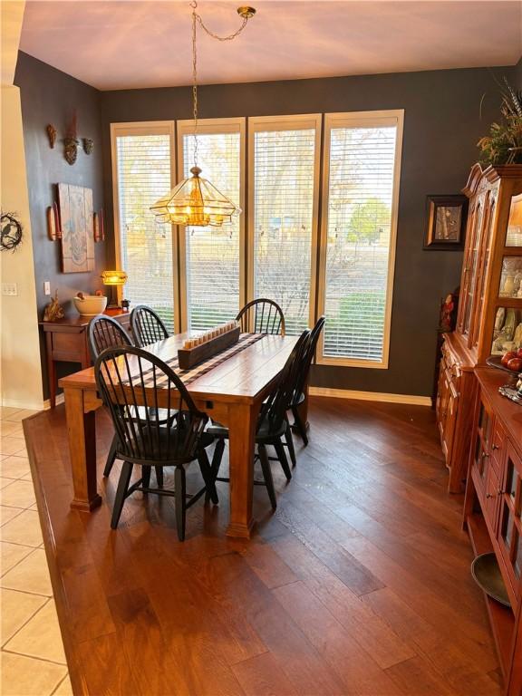 dining space featuring wood-type flooring