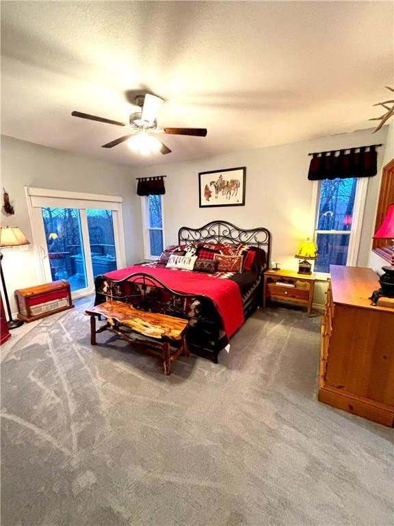 carpeted bedroom featuring ceiling fan