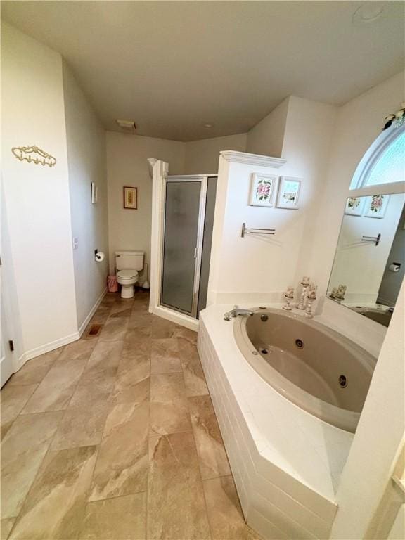 bathroom featuring shower with separate bathtub and toilet