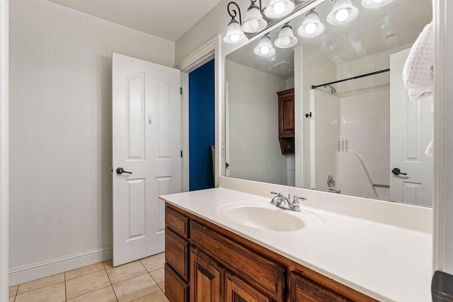 bathroom with vanity, tile patterned floors, and walk in shower