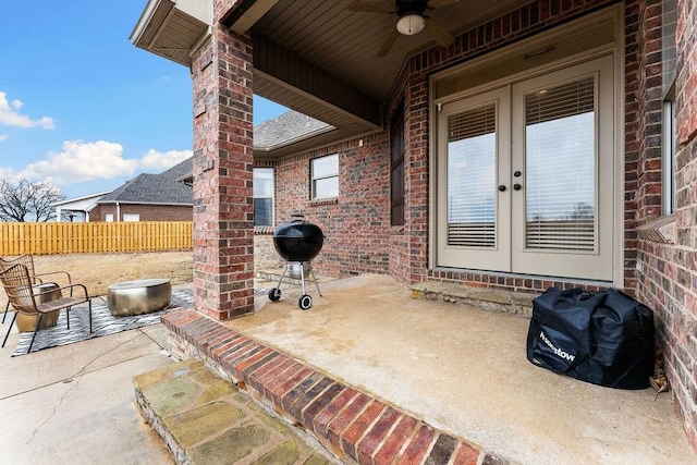 view of patio with french doors, ceiling fan, and grilling area