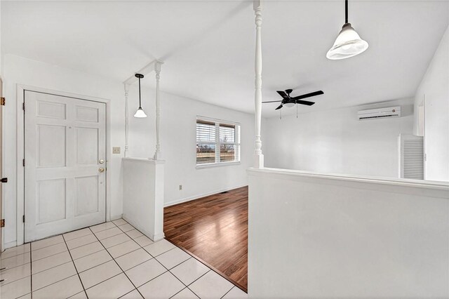 913 17th St, Rogers, AR 72758 - tiled foyer with ceiling fan and a wall mounted air conditioner