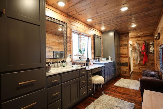 bathroom with wood ceiling, vanity, hardwood / wood-style flooring, and wood walls