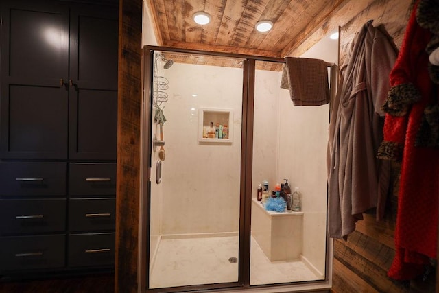 bathroom with wood ceiling and a shower with door