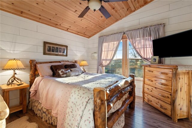 bedroom with lofted ceiling, wood ceiling, ceiling fan, wooden walls, and dark hardwood / wood-style flooring