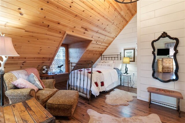 bedroom featuring wood walls, lofted ceiling, hardwood / wood-style floors, and wooden ceiling