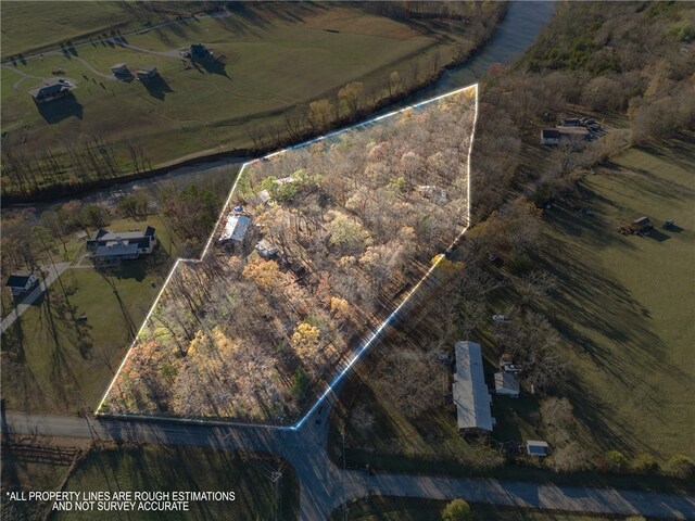 birds eye view of property featuring a rural view