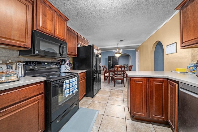 kitchen featuring light tile patterned floors, kitchen peninsula, pendant lighting, decorative backsplash, and black appliances