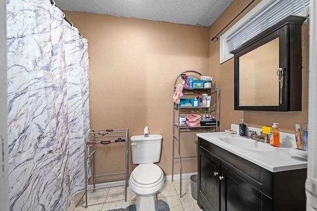 bathroom featuring tile patterned floors, toilet, a textured ceiling, vanity, and curtained shower