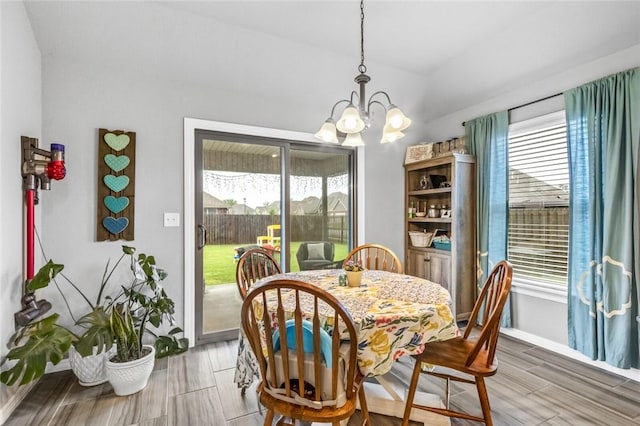 dining space featuring plenty of natural light and a chandelier