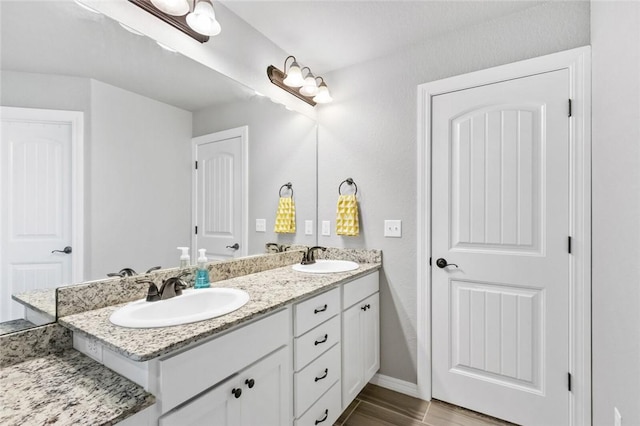 bathroom with vanity and hardwood / wood-style floors