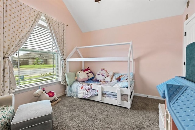 carpeted bedroom featuring lofted ceiling